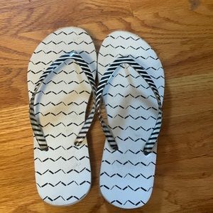 Black and white flip flops